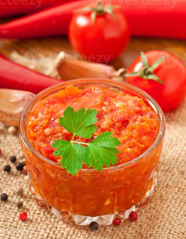 Red hot chili pepper and ingredients for sauce and sauce photo