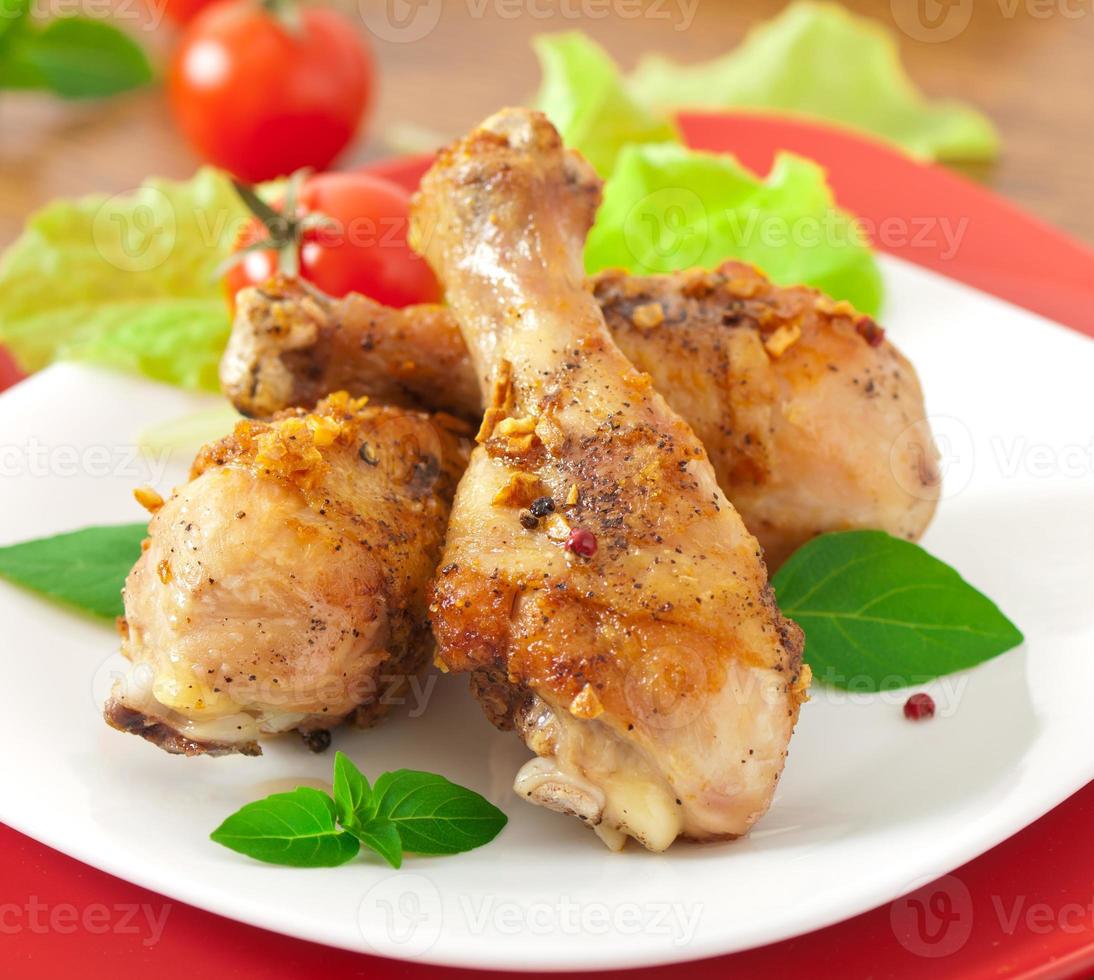 Grilled chicken legs and vegetables photo