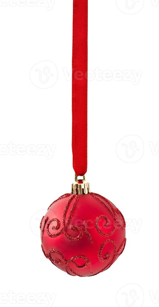 Three Christmas red balls hanging on ribbon isolated on white photo