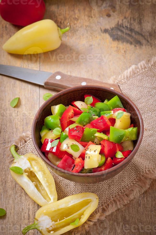 salad of sweet colorful peppers with olive oil photo