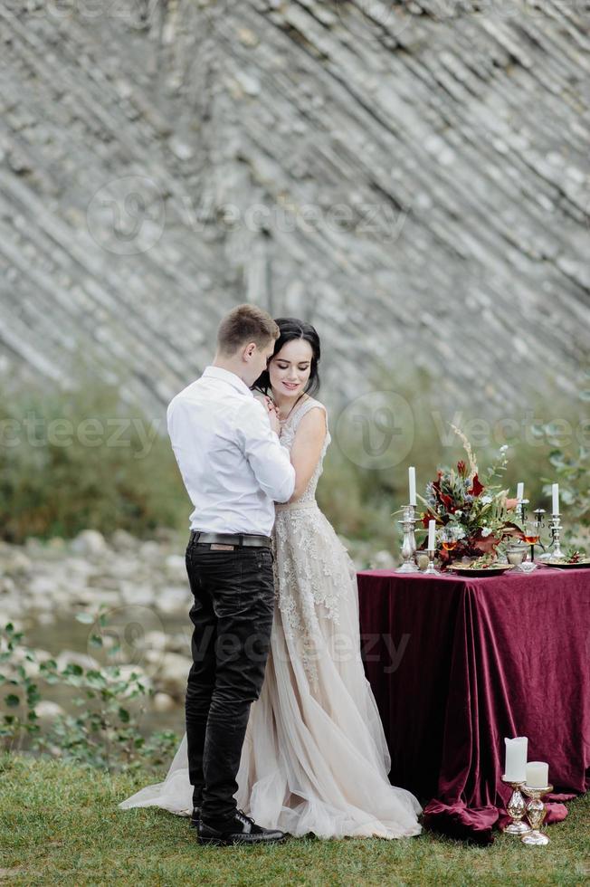 the bride and groom. wedding ceremony on the background of the mountains photo