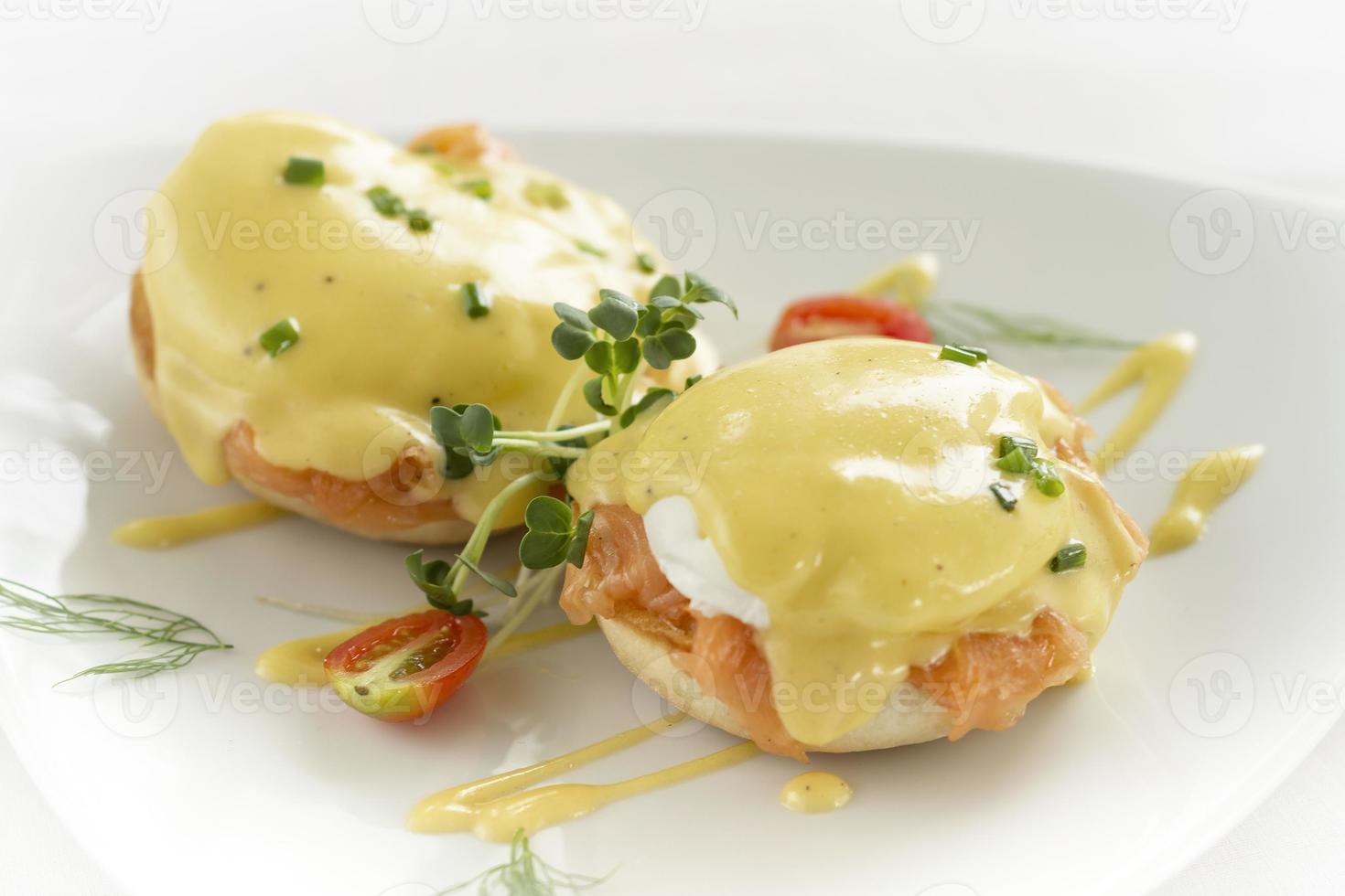 eggs benedict royale breakfast with smoked salmon and hollandaise sauce photo