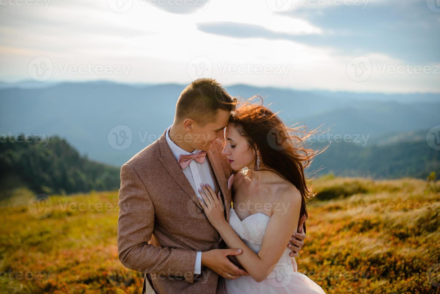Young love couple celebrating a wedding in the mountains photo