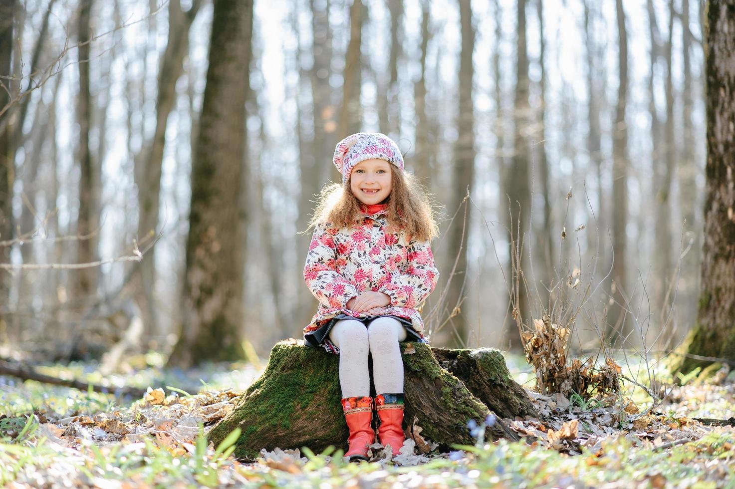 Little girl in the forest photo