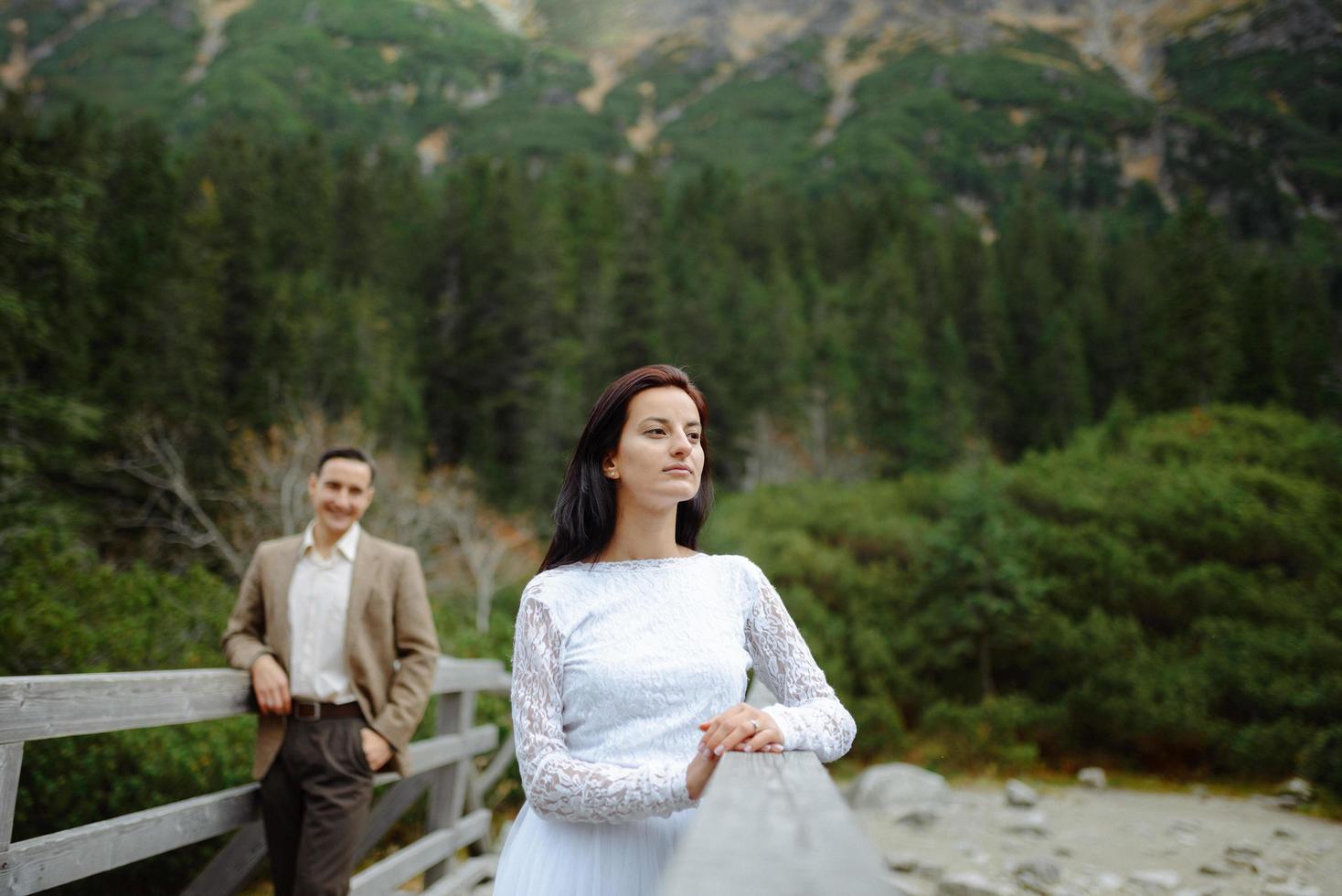 Beautiful couple walking among rocks photo