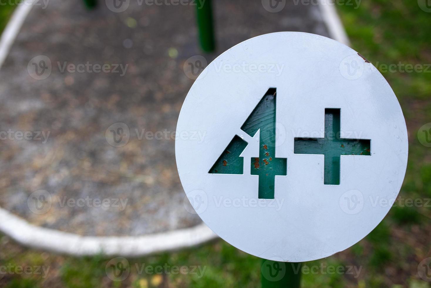 Age limit warning sign on the playground. photo