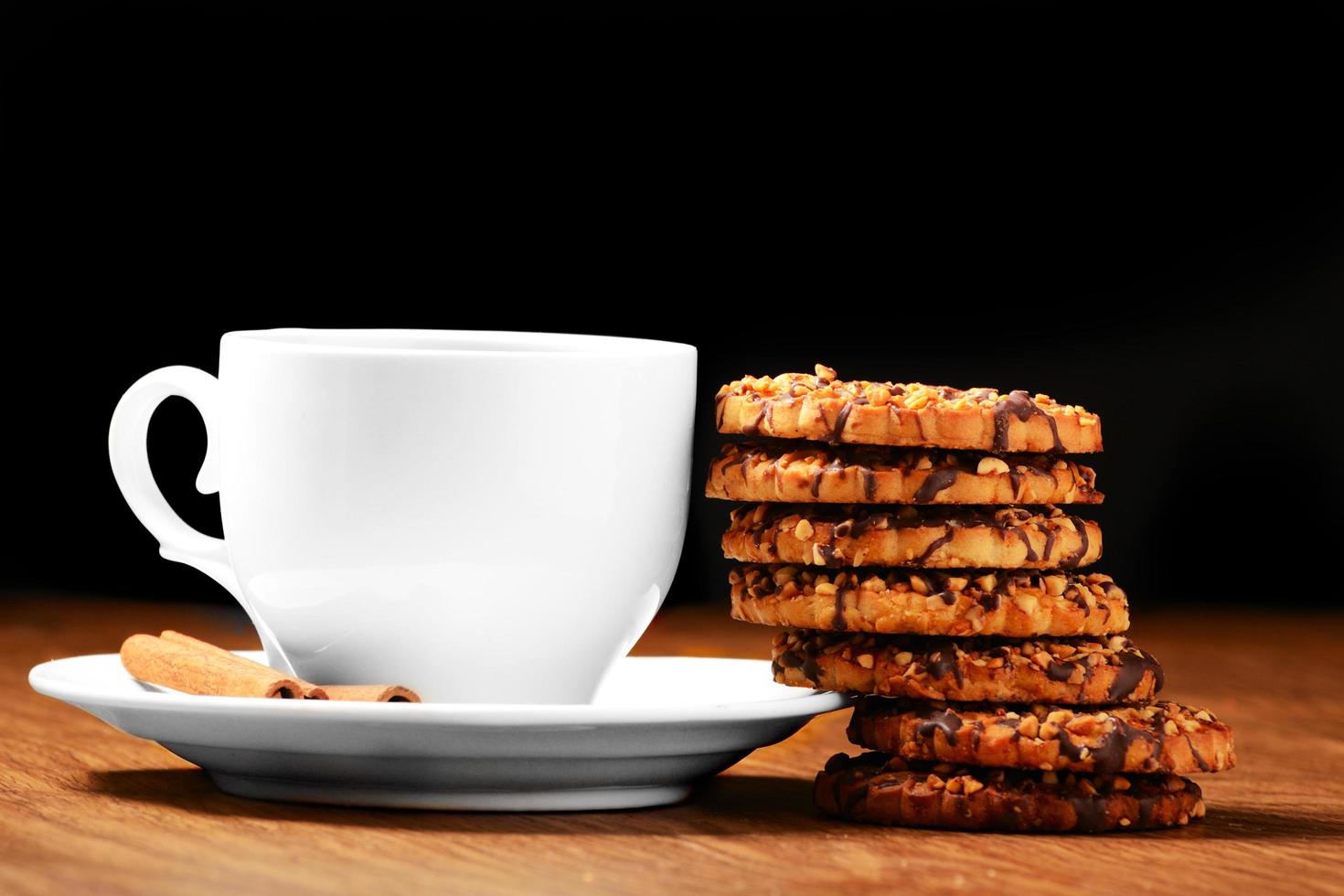 Black tee and tasty cookies at breakfast photo