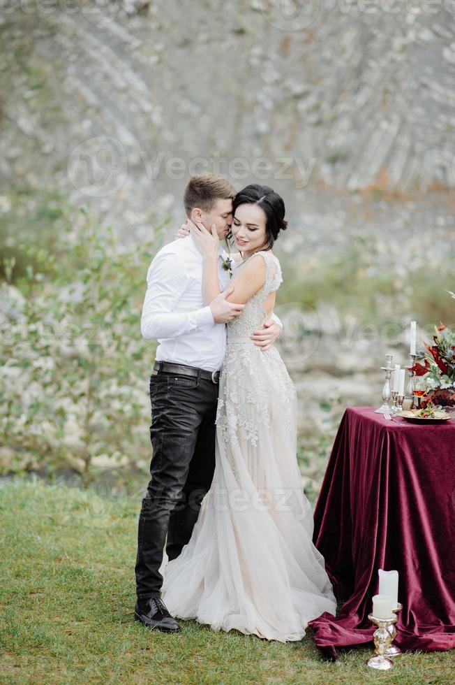 the bride and groom. wedding ceremony on the background of the mountains photo