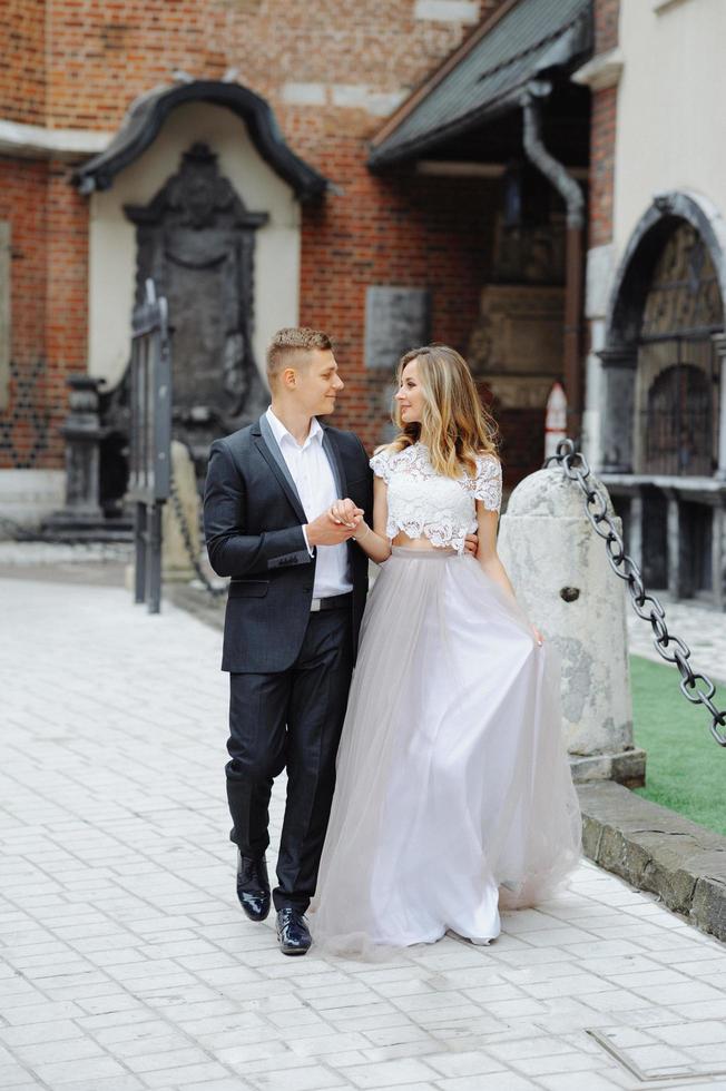 Two lovers walk along Krakow photo