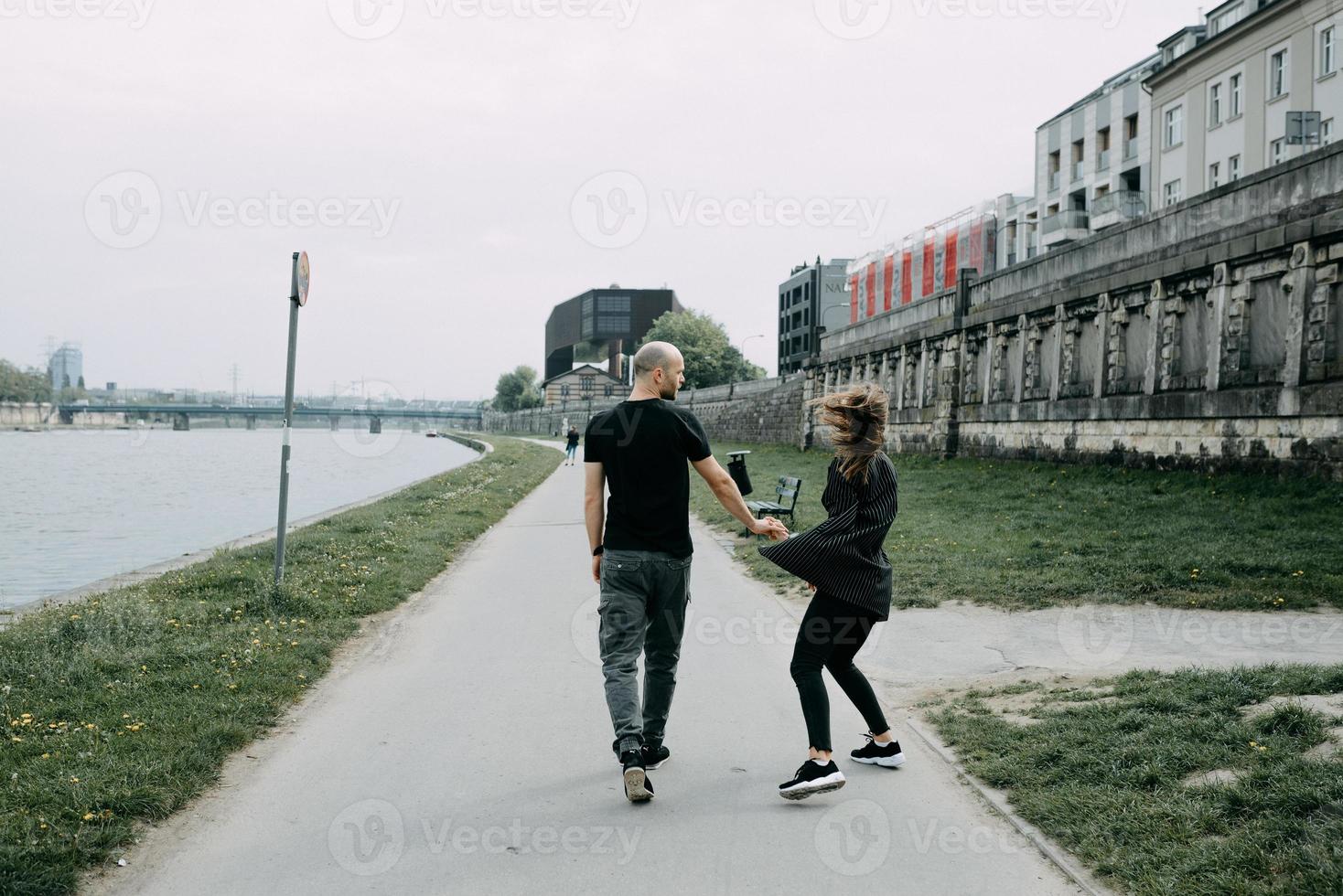 Happy couple. Loving couple enjoying in moments of happiness in the park. Love and tenderness, dating, romance. Lifestyle concept photo