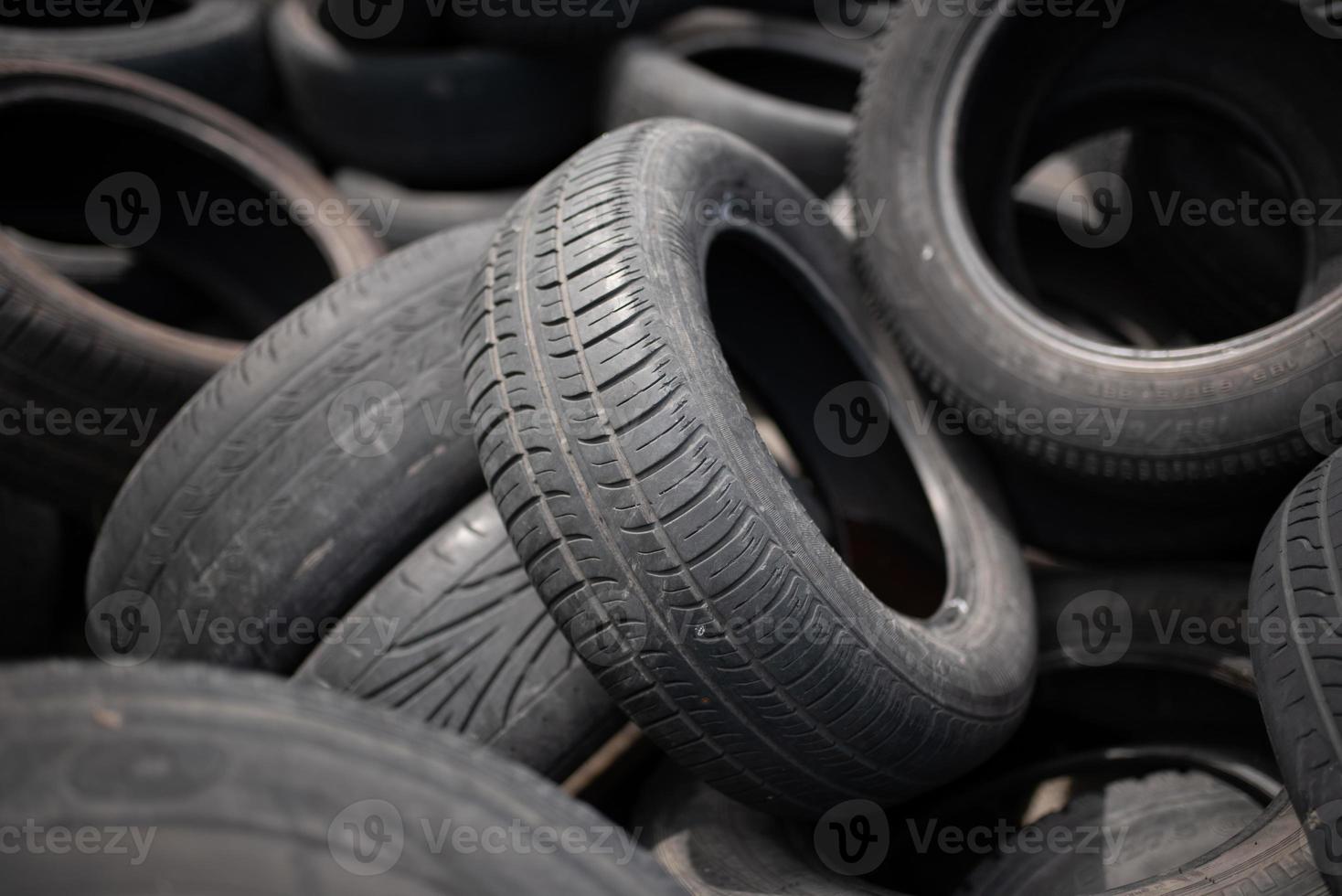 Old black car tires. Unauthorized dump. photo