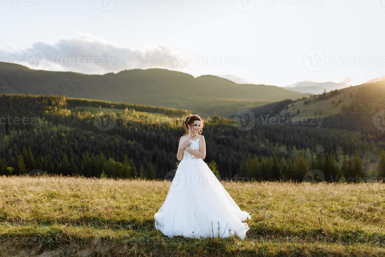 Bride in the mountains. The concept of lifestyle and wedding. photo