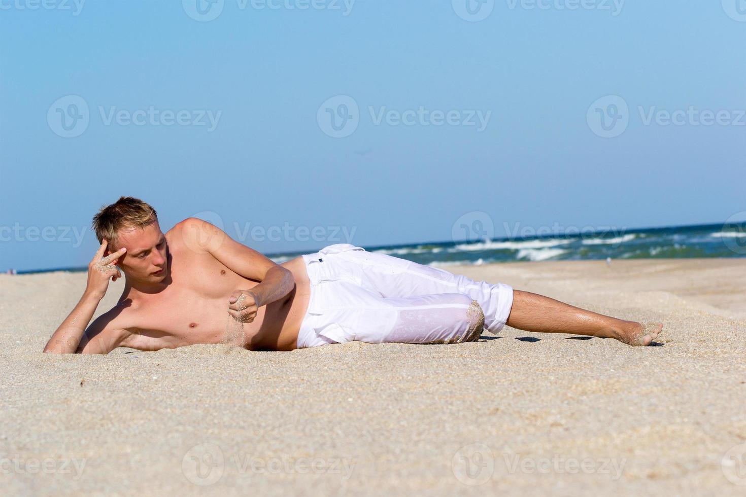A young man by the sea photo