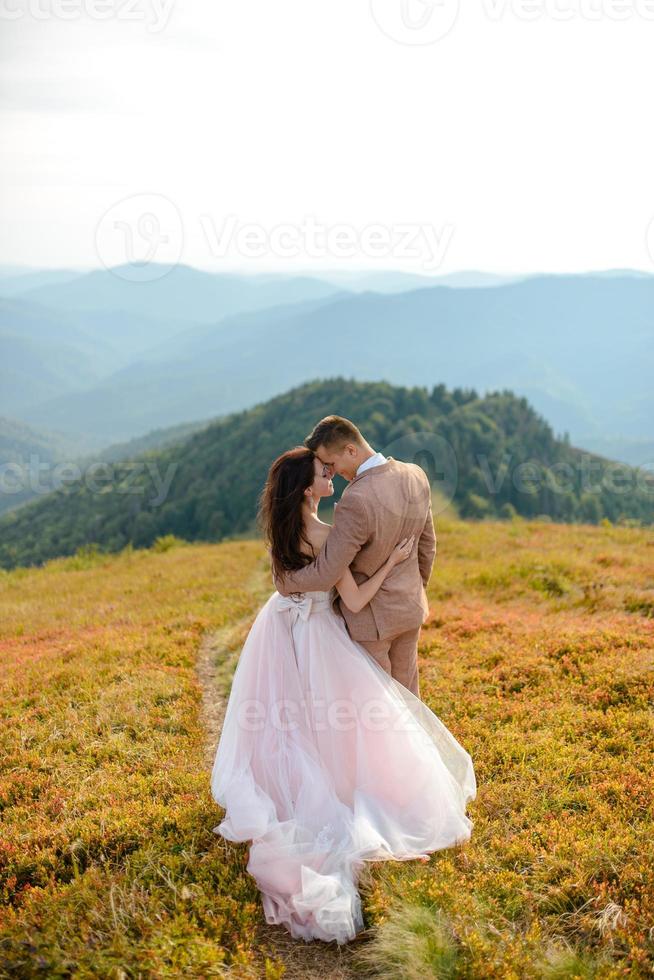 Young love couple celebrating a wedding in the mountains photo