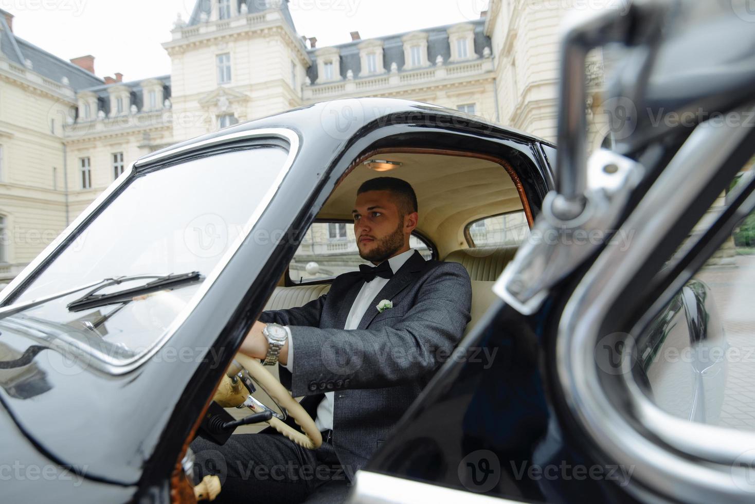 Handsome man in the car, businessman photo