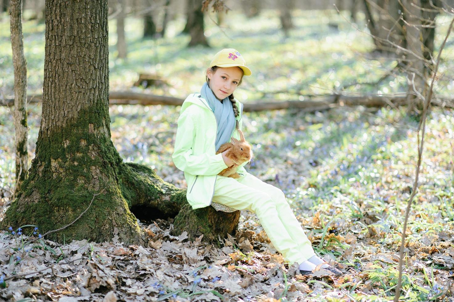 Little girl with a rabbit photo