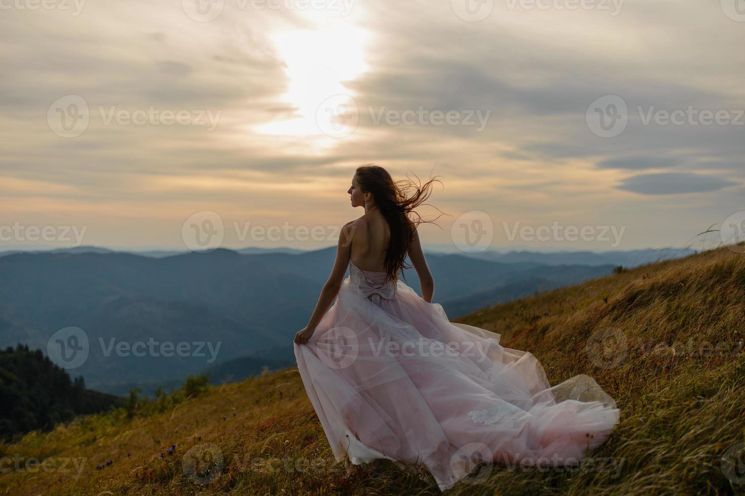 Bride in the mountains. The concept of lifestyle and wedding. photo