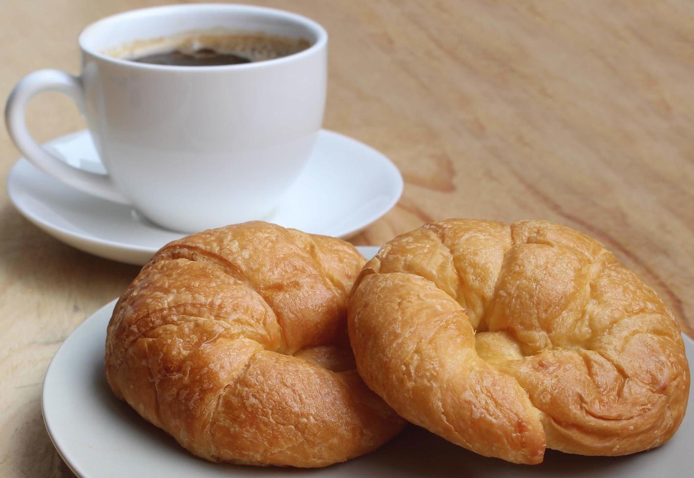 Cup of coffee and Croissant Breakfast Fast photo
