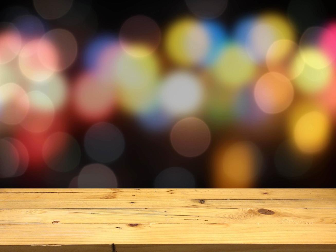 Wood for placing the product on the bokeh colors background photo