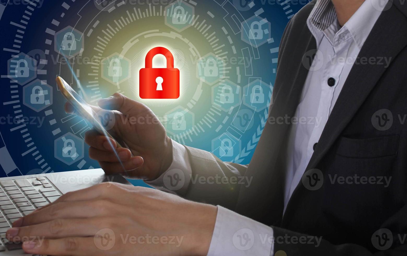 Businessman use Laptop and smartphone with padlock and circle technology background, Cyber Security Data Protection Business Technology Privacy concept, Internet Concept of global business photo