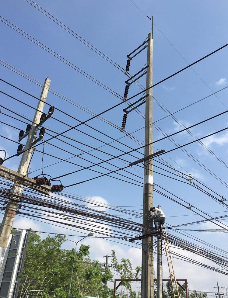 Outdoor electrical maintenance technicians who are skilled, the danger zone. photo