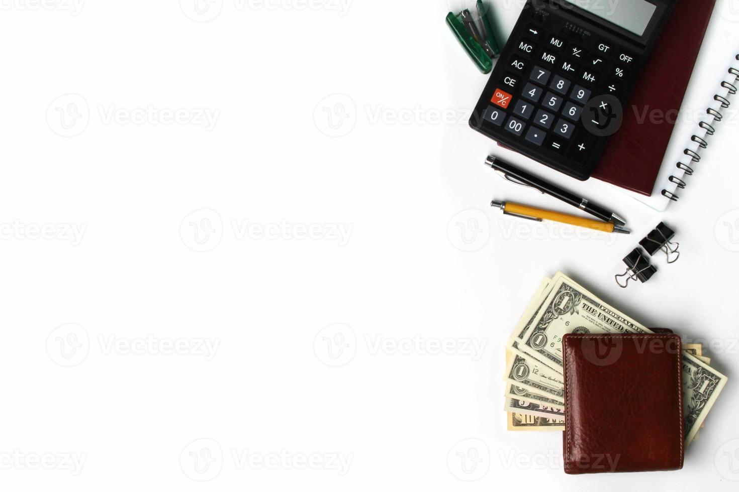 White office desk with copy space, pen, wallet, and supplies. Top view with copy space photo