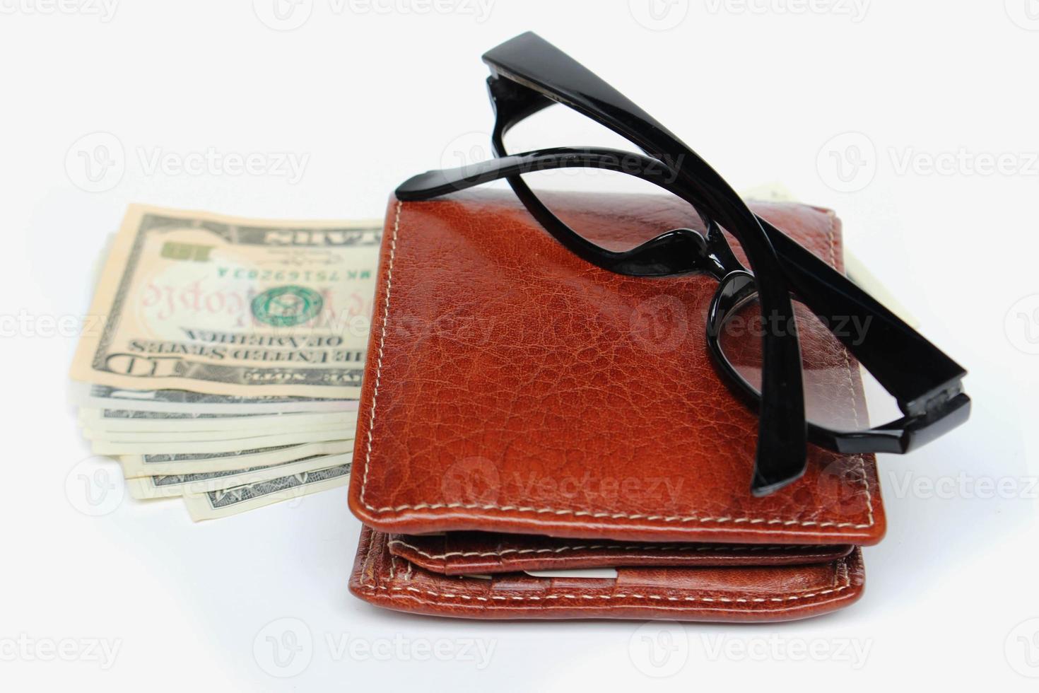 Wallets and glasses on a white background photo