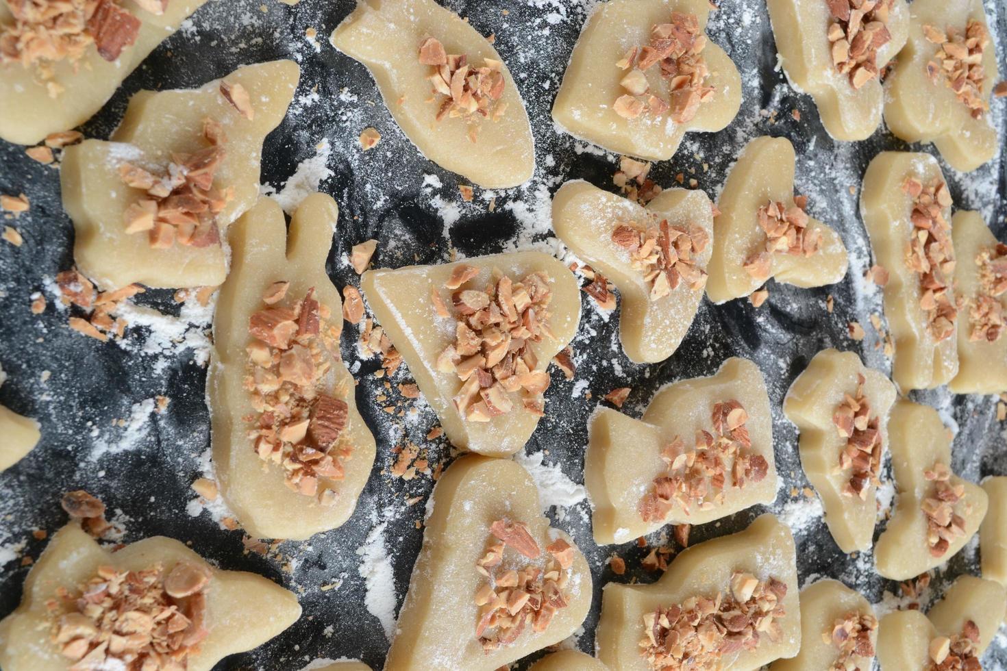 Raw cookies on baking tray photo