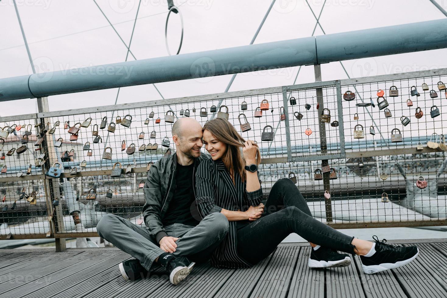 Young romantic couple on river embankment photo