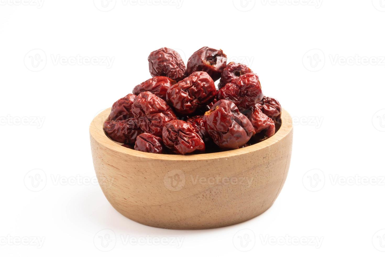 Dried Chinese jujube in a cup on white background. Isolated image. photo