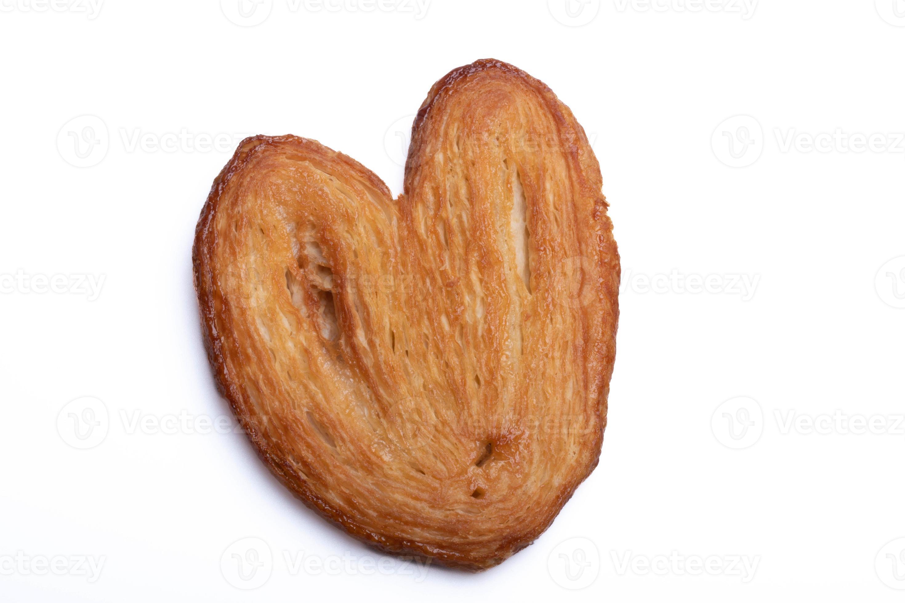 Heart-shaped baked bread, baking puff pastry on white background