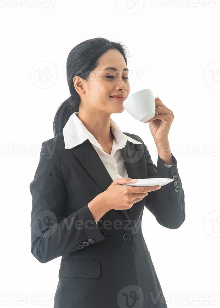 Portrait young beautiful smiling happy woman wear black suit  holding drinking coffee on isolated white background. photo