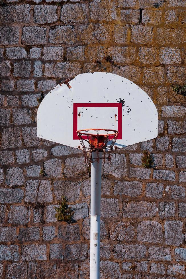 old street basketball hoop, sports equipment photo