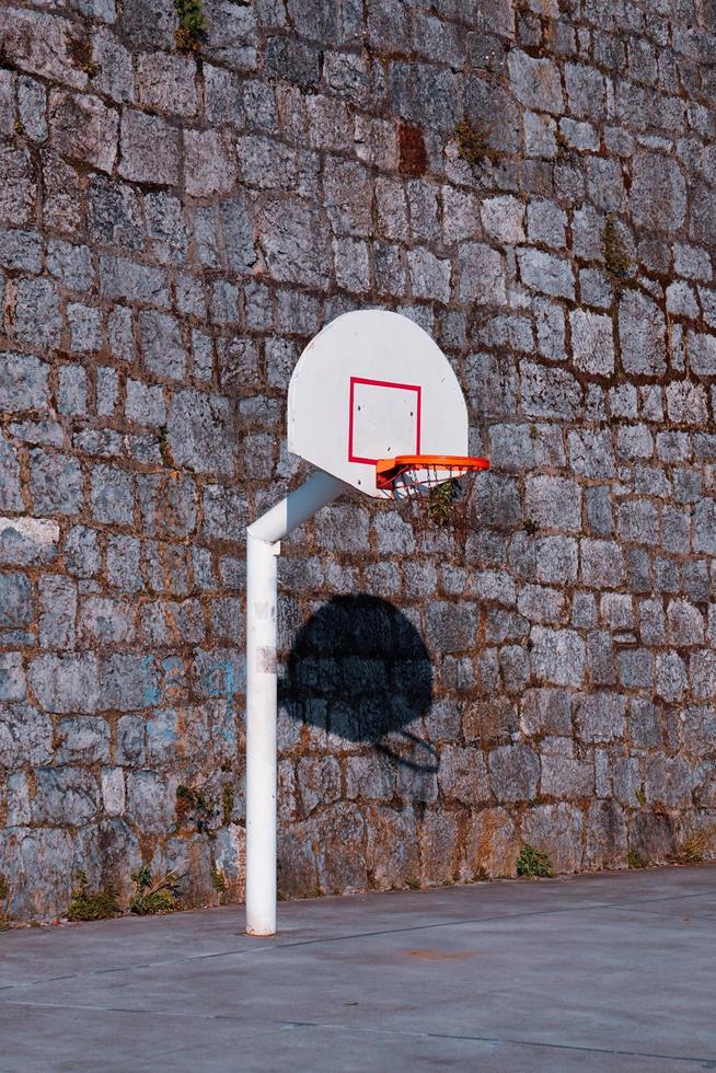 old street basketball hoop, sports equipment photo