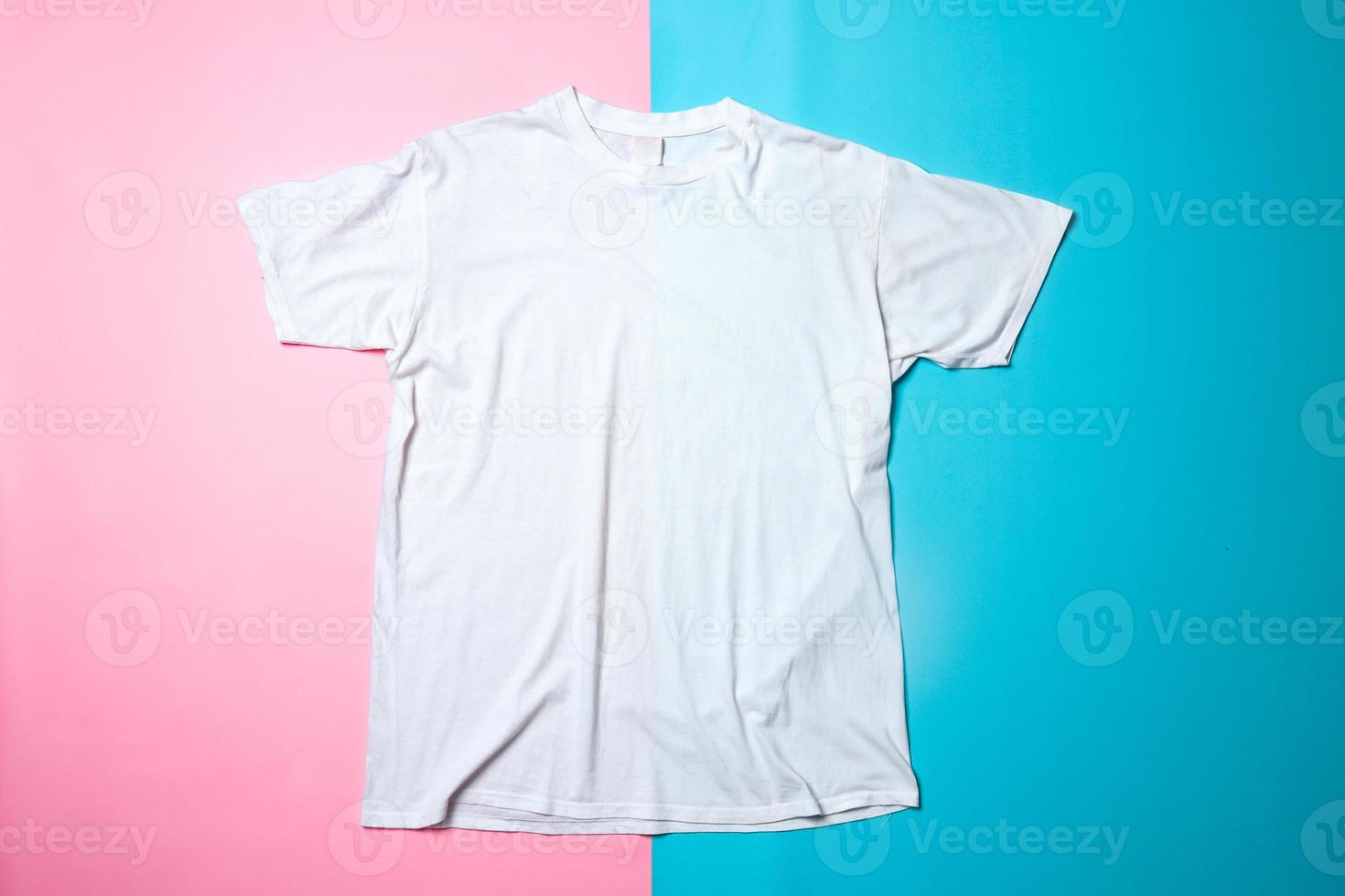 White t-shirt mockup on colorful background. Flat lay tee template photo