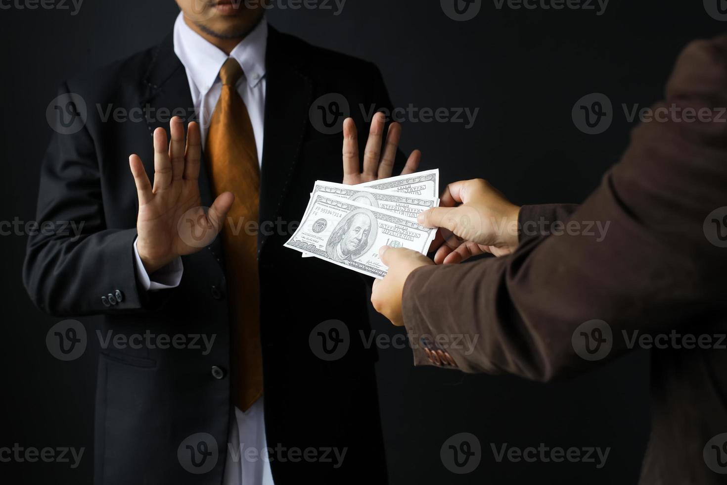 Corruption and Bribery,Businessman manager refusing receive money dollar bills to deal contract photo