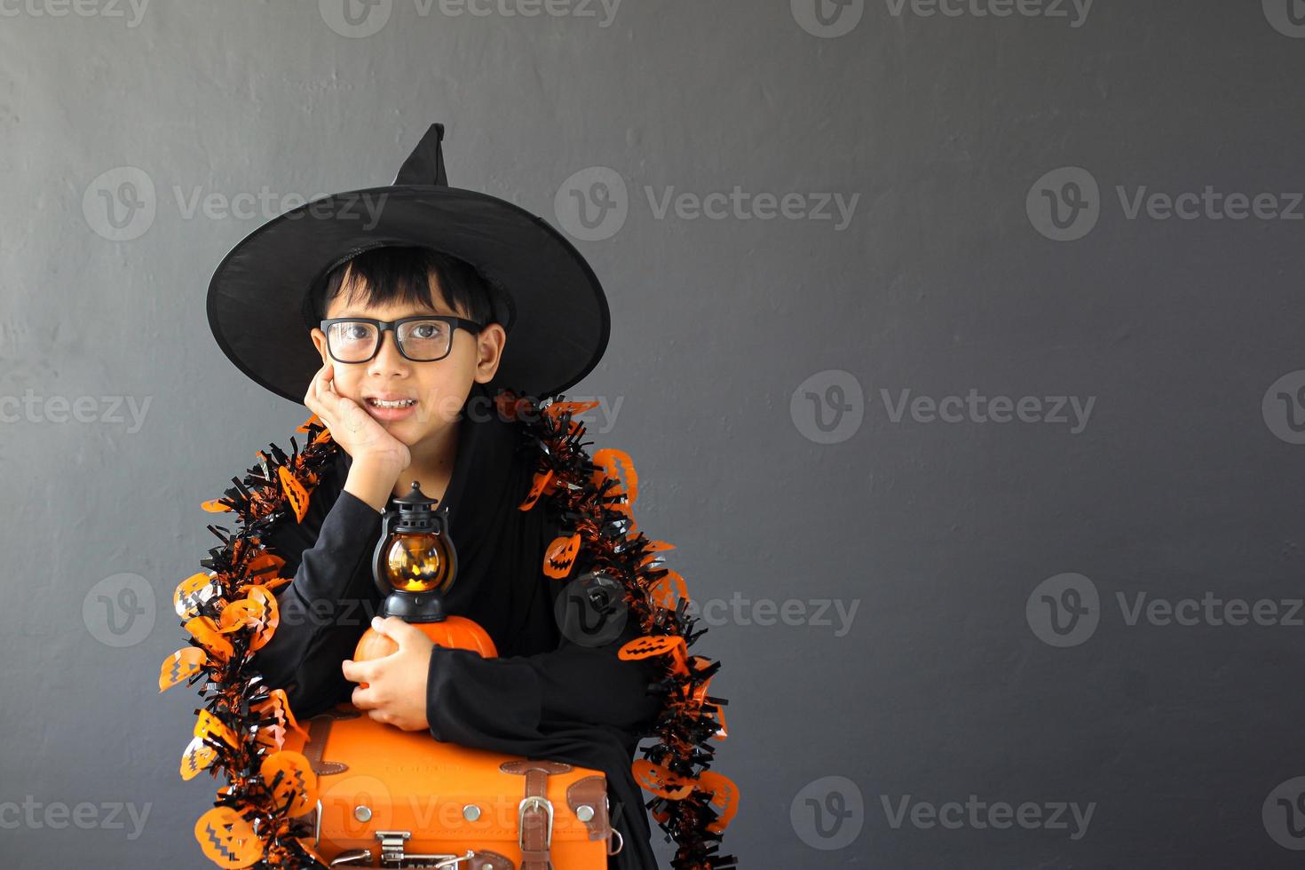 A cute boy wearing halloween costume and accessories photo