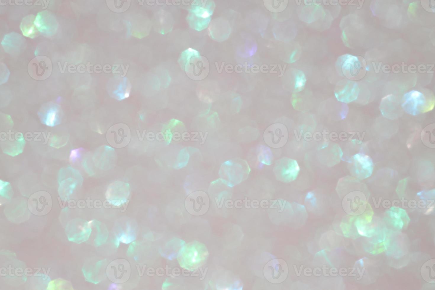 Grey pastel sparkle blurry background with blurred green shiny  dots texture photo