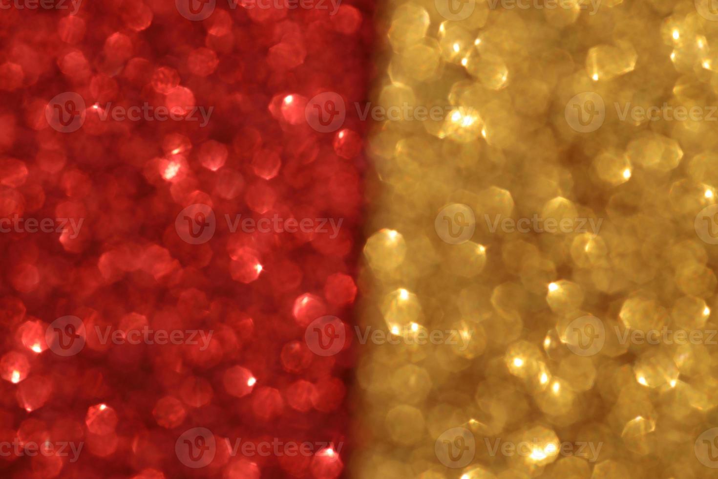 Red and gold sparkle blurry background with blur dots texture photo