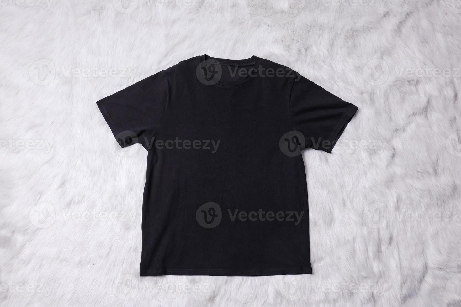 Grey t-shirt mockup on grey background. Flat lay tee template photo