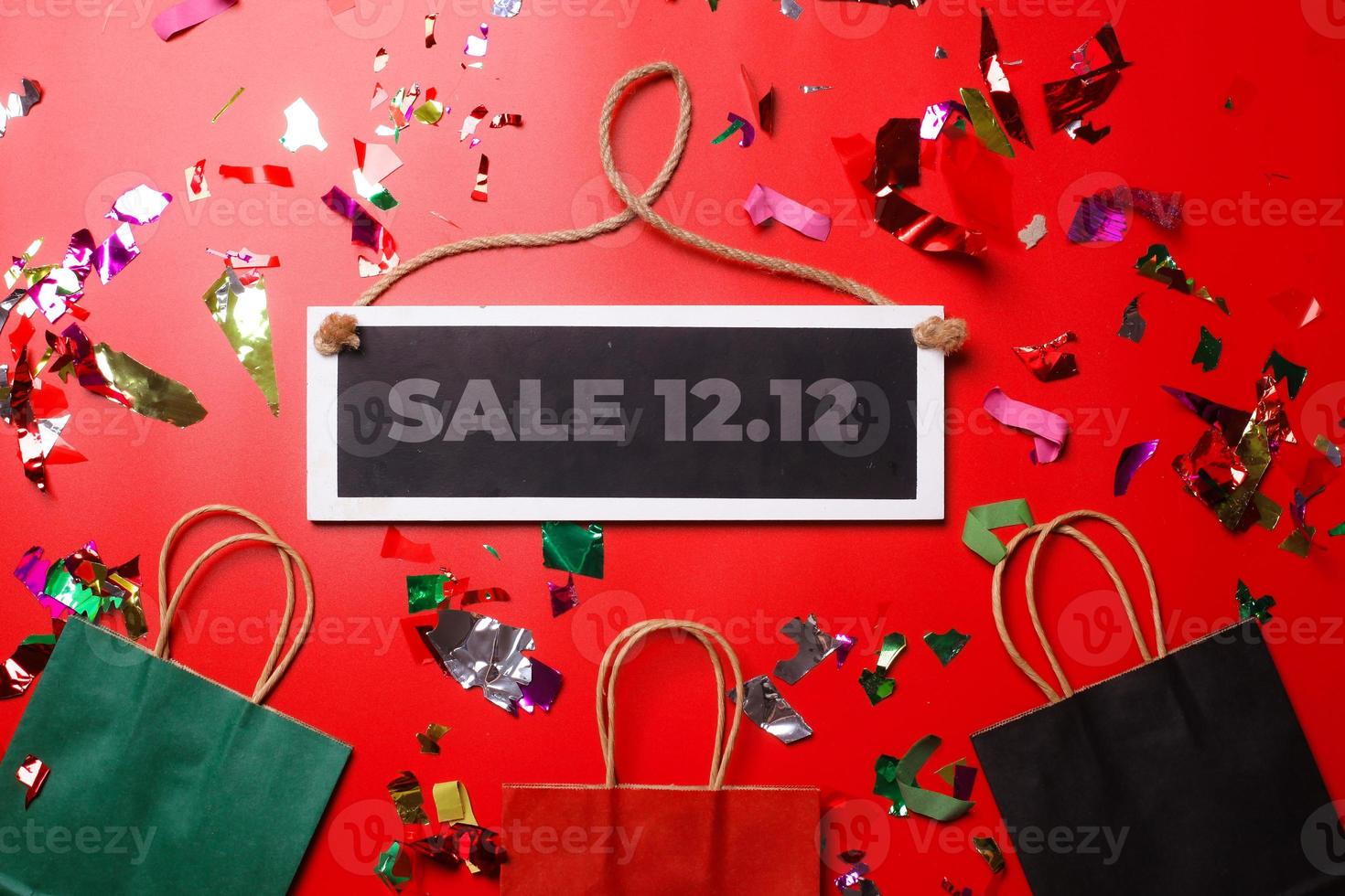 12.12 Shopping day super sale flat lay concept on red background photo