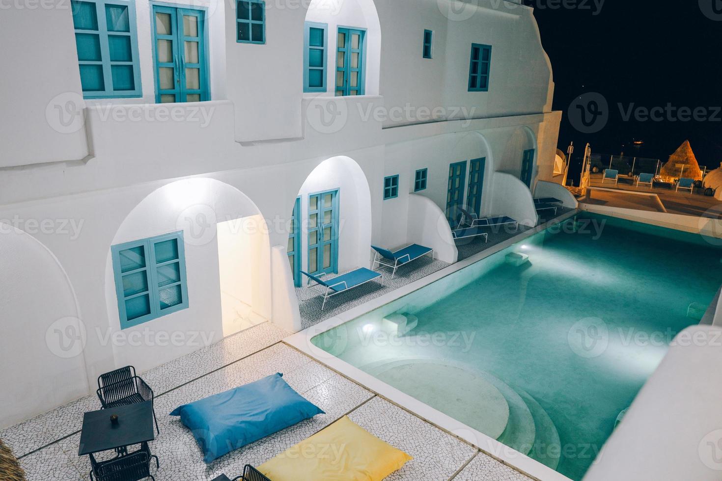 Top view of swimming pool in the middle of art deco resort building at night. Labuan bajo, Indonesia, August 2021 photo