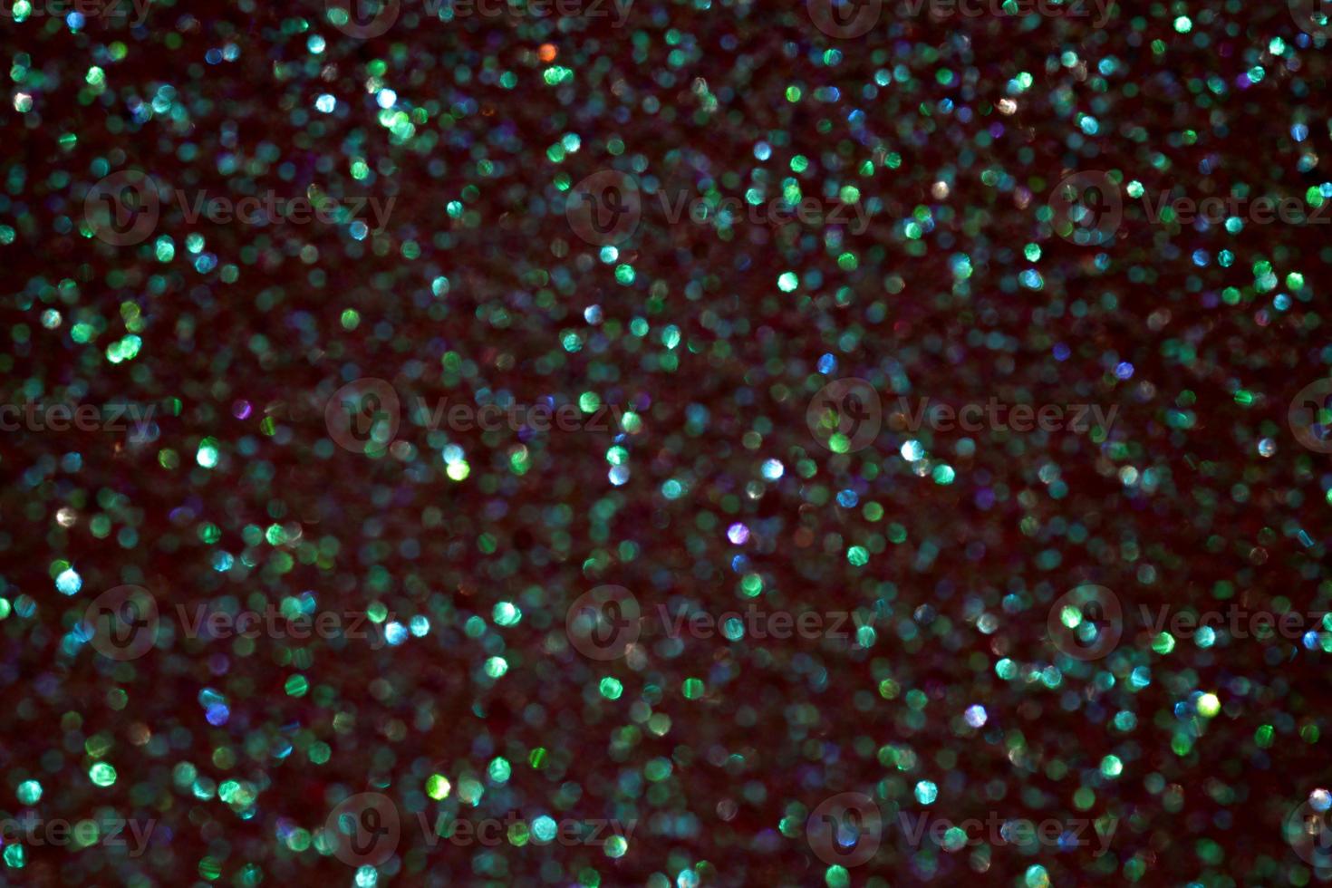 Green sparkle blurry background with fuzzy dots texture photo