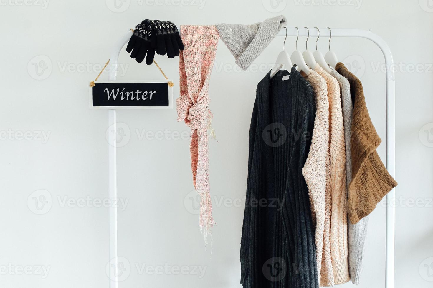 Winter clothes and accessories on hanger photo