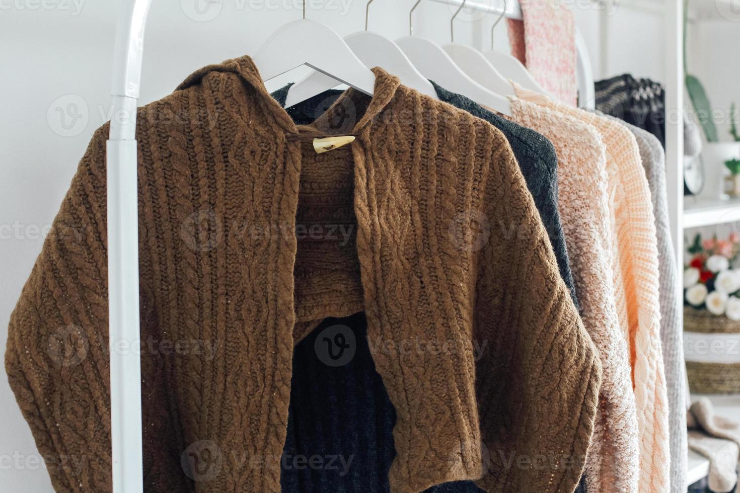 Winter clothes and accessories on hanger photo