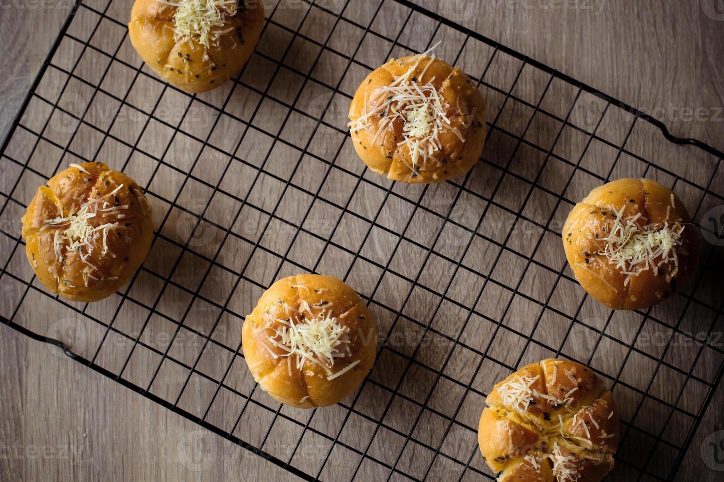 Garlic Cheese Bread or Yugjjog Maneulppang is Korean Popular Street Food served on the table photo