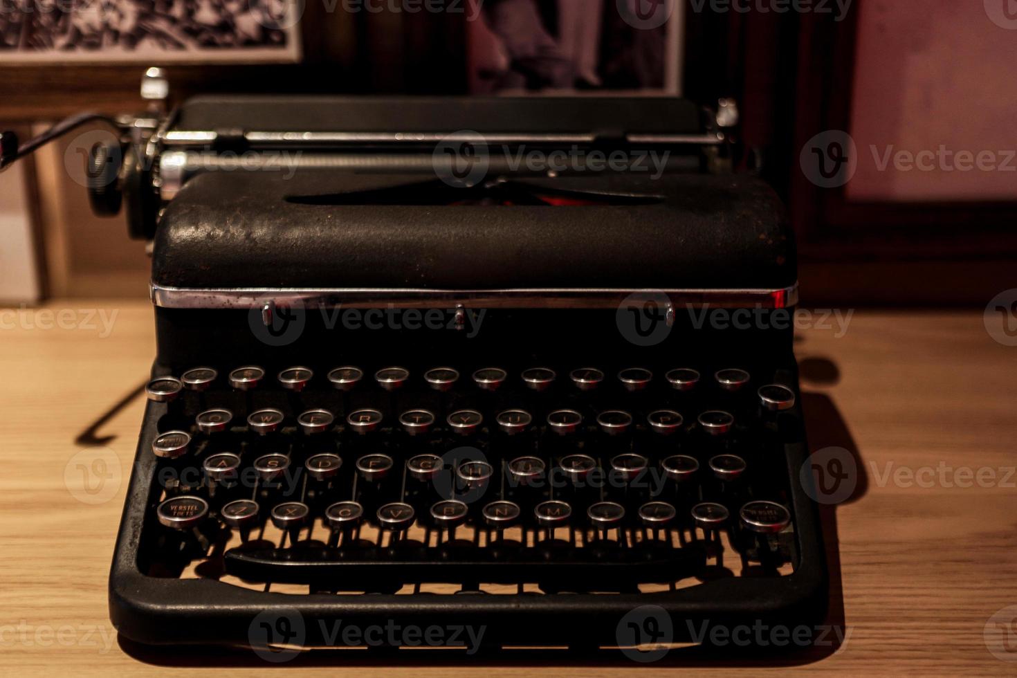 Vintage and retro typewriter on the wooden table photo