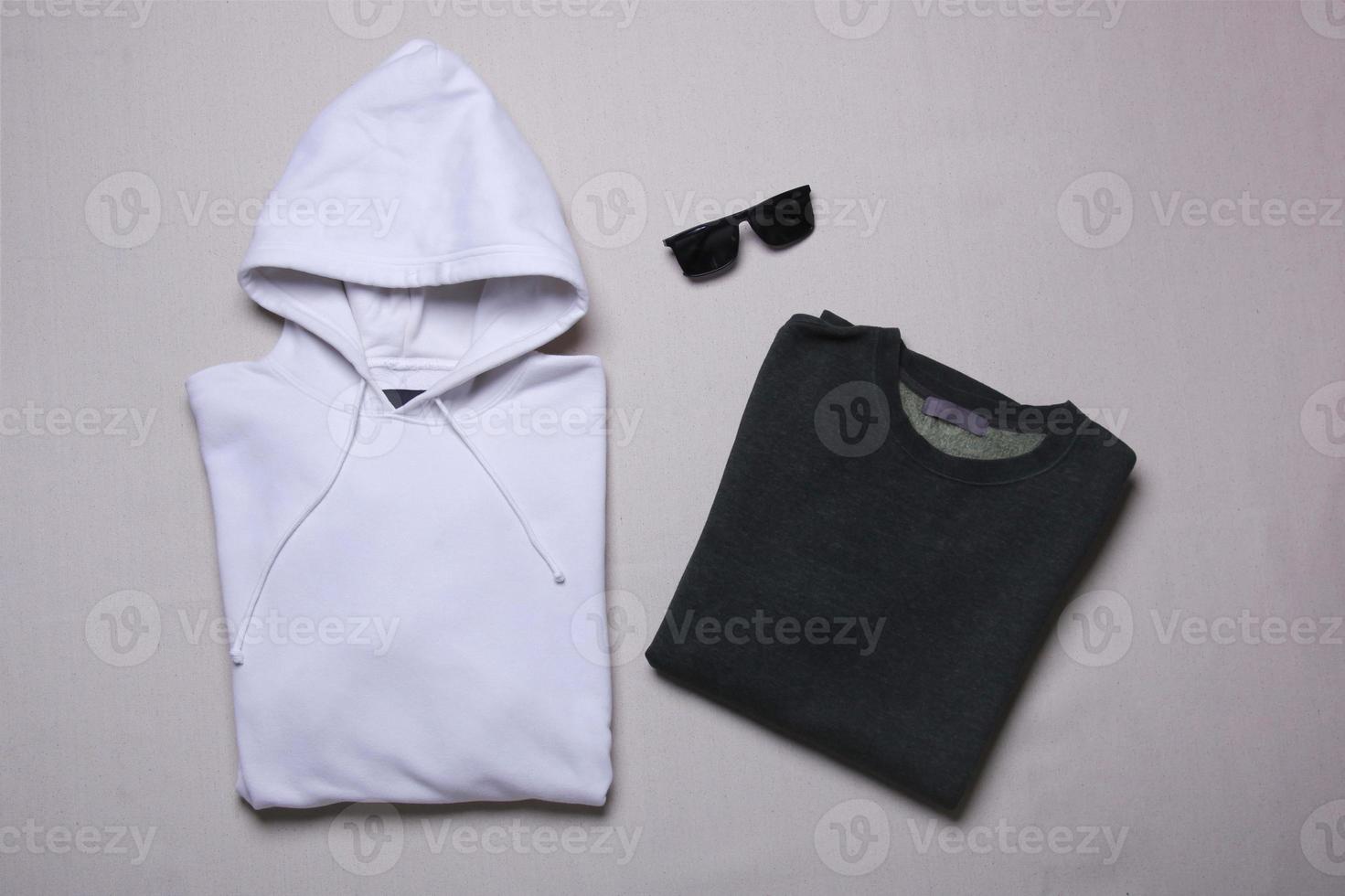 Folded sweatshirt and hoodie mockup on grey background. Flat lay men's outwear template photo