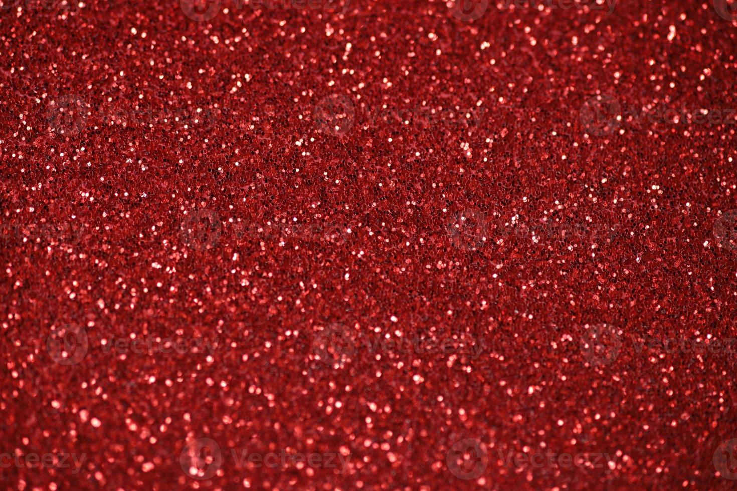 Red sparkle blurry background with glittering white dots texture photo