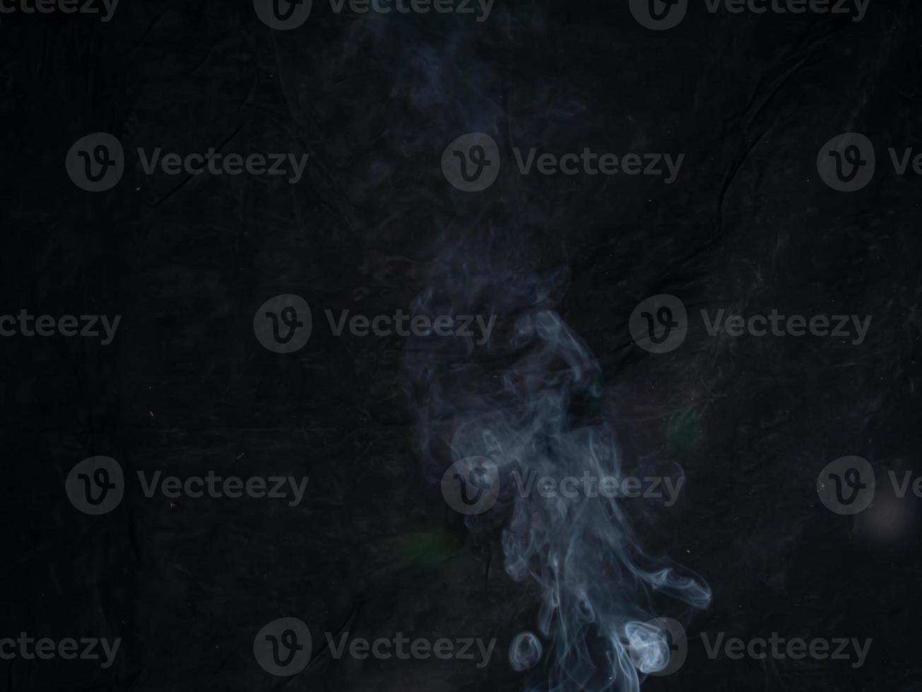 smoke texture on black background. photo
